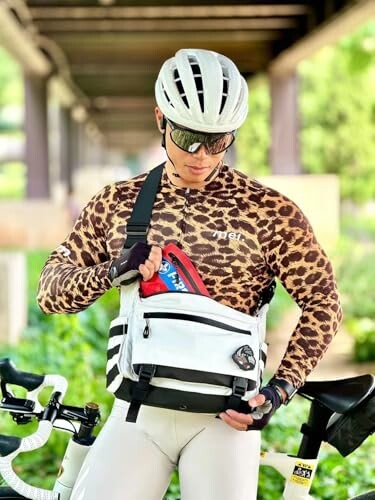 Cyclist with helmet and leopard print shirt holding a bag