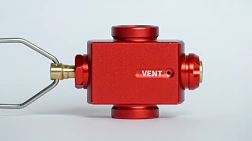 Red metal valve with vent label